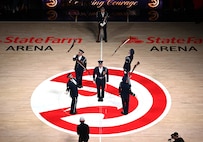 The U.S. Air Force Honor Guard Drill Team performs a weapons drill routine during an NBA halftime show in Atlanta, Ga., March 12, 2026. The Drill Team traveled to Georgia to perform for five high schools, a community event, and during a halftime show for the Atlanta Hawks vs. Brooklyn Nets basketball game to showcase the Air Force’s precision and excellence. (U.S. Air Force photo by Tech. Sgt. Sergio A. Gamboa)