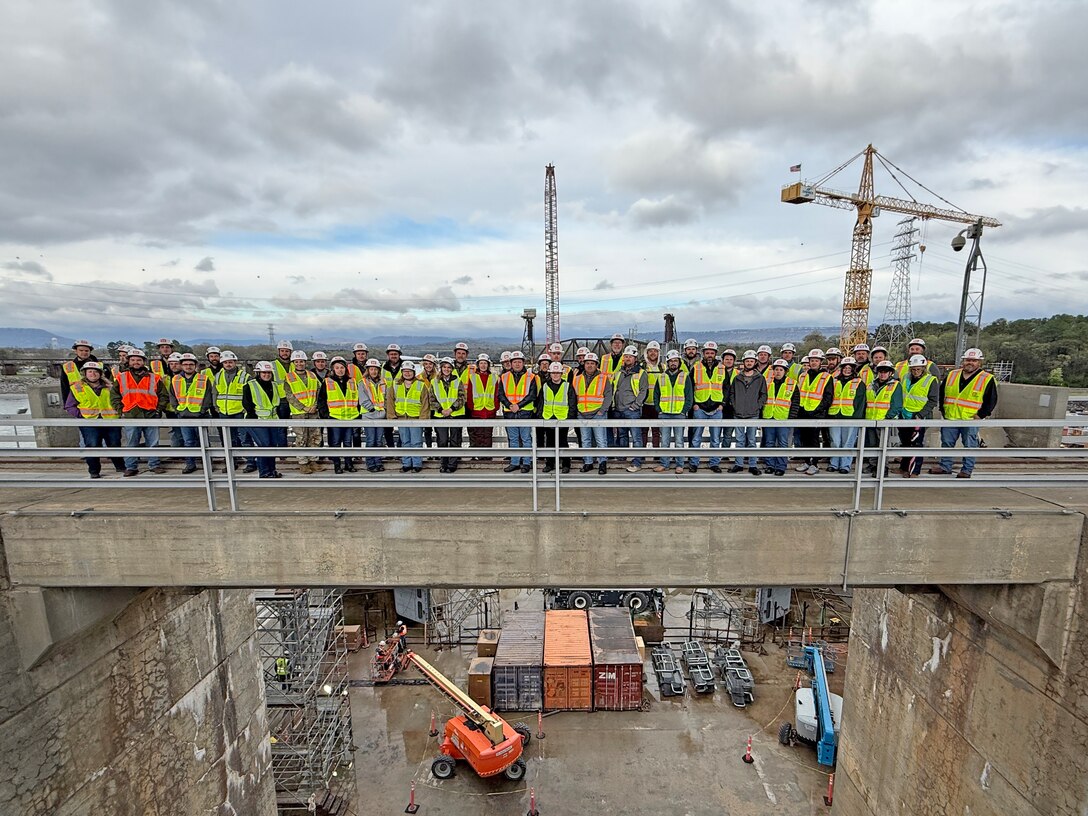 The U.S. Army Corps of Engineers Nashville District’s park rangers pose during a tour of the Chickamauga Lock Replacement Project March 12, 2026, on the Tennessee River in Chattanooga, Tennessee, during the annual Park Ranger Workshop. The park rangers benefitted from visiting the navigation lock that is being replaced by a larger more efficient lock under construction.  (USACE Photo by Lee Roberts)