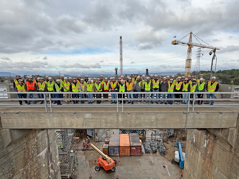 The U.S. Army Corps of Engineers Nashville District’s park rangers pose during a tour of the Chickamauga Lock Replacement Project March 12, 2026, on the Tennessee River in Chattanooga, Tennessee, during the annual Park Ranger Workshop. The park rangers benefitted from visiting the navigation lock that is being replaced by a larger more efficient lock under construction.  (USACE Photo by Lee Roberts)