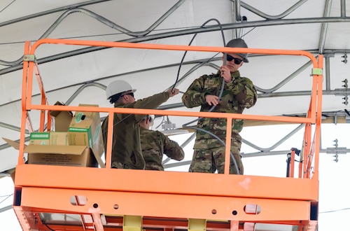 Airmen install lights