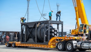 A containerized nuclear power reactor sits secured within a reinforced steel transport frame at March Air Reserve Base, California, Feb. 13, 2026. The system is part of an interagency demonstration evaluating the feasibility of rapidly deploying nuclear power using strategic airlift. (U.S. Air Force photo by SSgt Monique Bright)