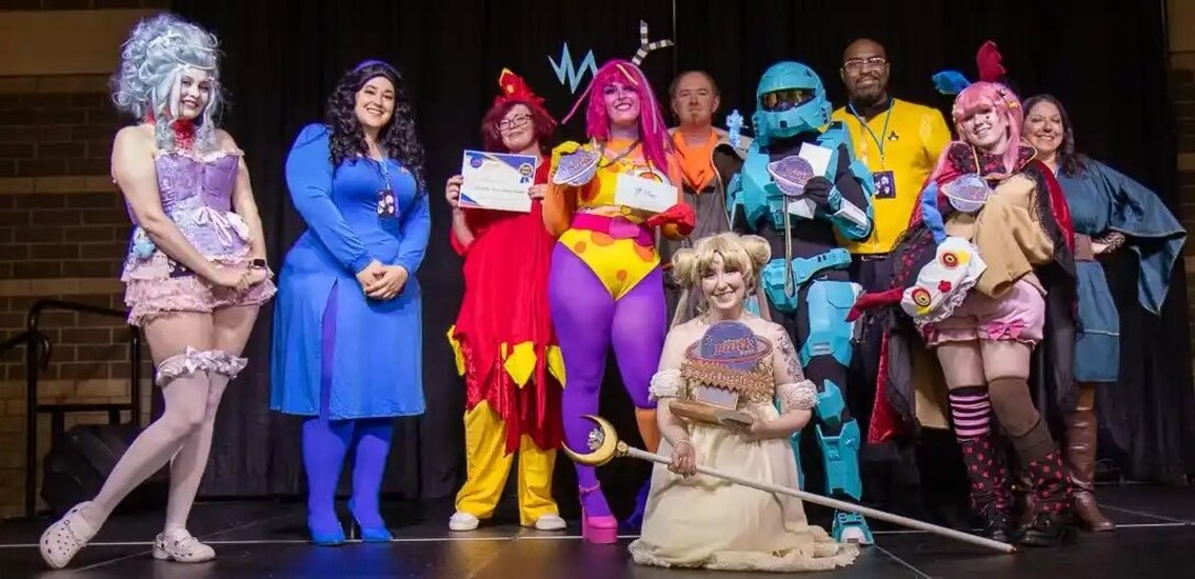 Attendees at the 2025 Planet Funk Con show their enthusiasm for the event, held at the River Center in Davenport, Iowa. The convention is organized by First Army civilian Marcus Gray.