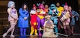 Attendees at the 2025 Planet Funk Con show their enthusiasm for the event, held at the River Center in Davenport, Iowa. The convention is organized by First Army civilian Marcus Gray.