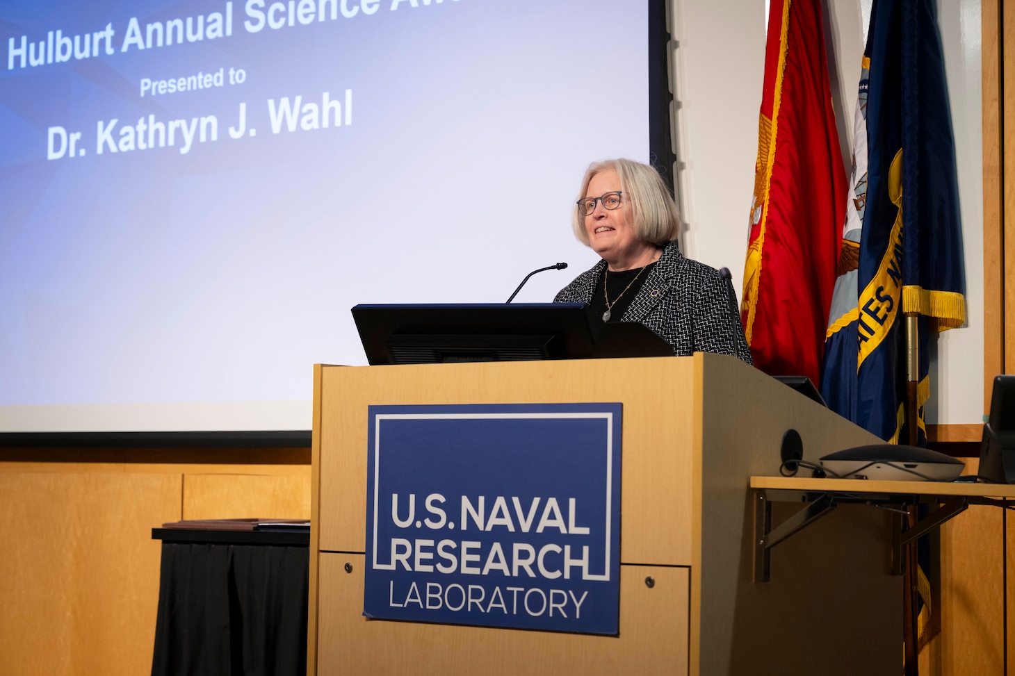 Kathryn Wahl, Ph.D., U.S. Naval Research Laboratory (NRL) Surface Chemistry branch head, gives remarks after receiving the 2025 E.O. Hulbert Annual Science Award in Washington, D.C., March 6, 2026. Wahl received the award for her significant advances in measurement, observation, and understanding of interfacial contacts. (U.S. Navy photo by Sarah Peterson)