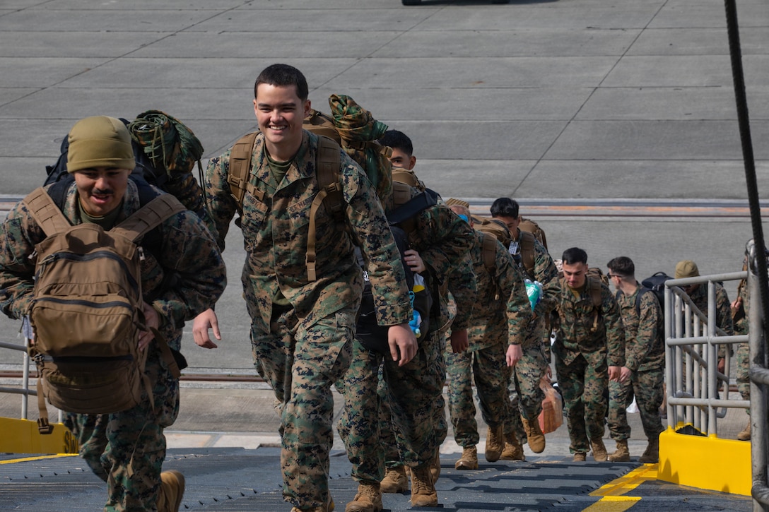 U.S. Marines with Marine Aircraft Group 12, 1st Marine Aircraft Wing, board U.S. Naval Ship Guam (T-HST 1) at Marine Corps Air Station Iwakuni, Japan, March 9, 2026. U.S. Marines and Sailors loaded personnel equipment onto the U.S. Navy’s Military Sealift Command high-speed transport ship Guam in support of exercise Korea Marine Exercise Program 26.1. (U.S. Marine Corps photo by Lance Cpl. Siwan Lewis)