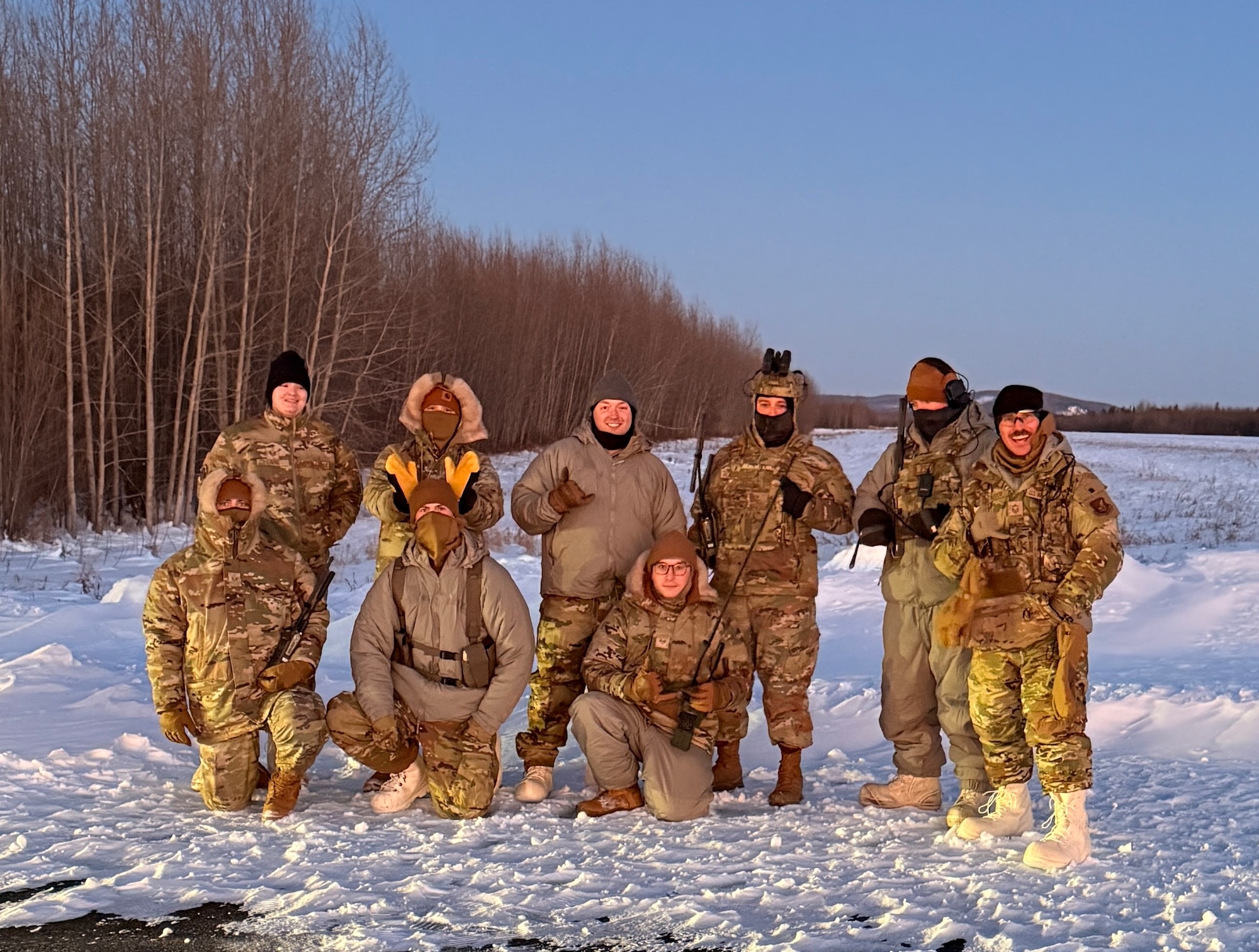 U.S. Air Force Airmen pose for a photo during a landing zone operation exercise at Eielson Air Force Base, Alaska, Dec. 8, 2025.