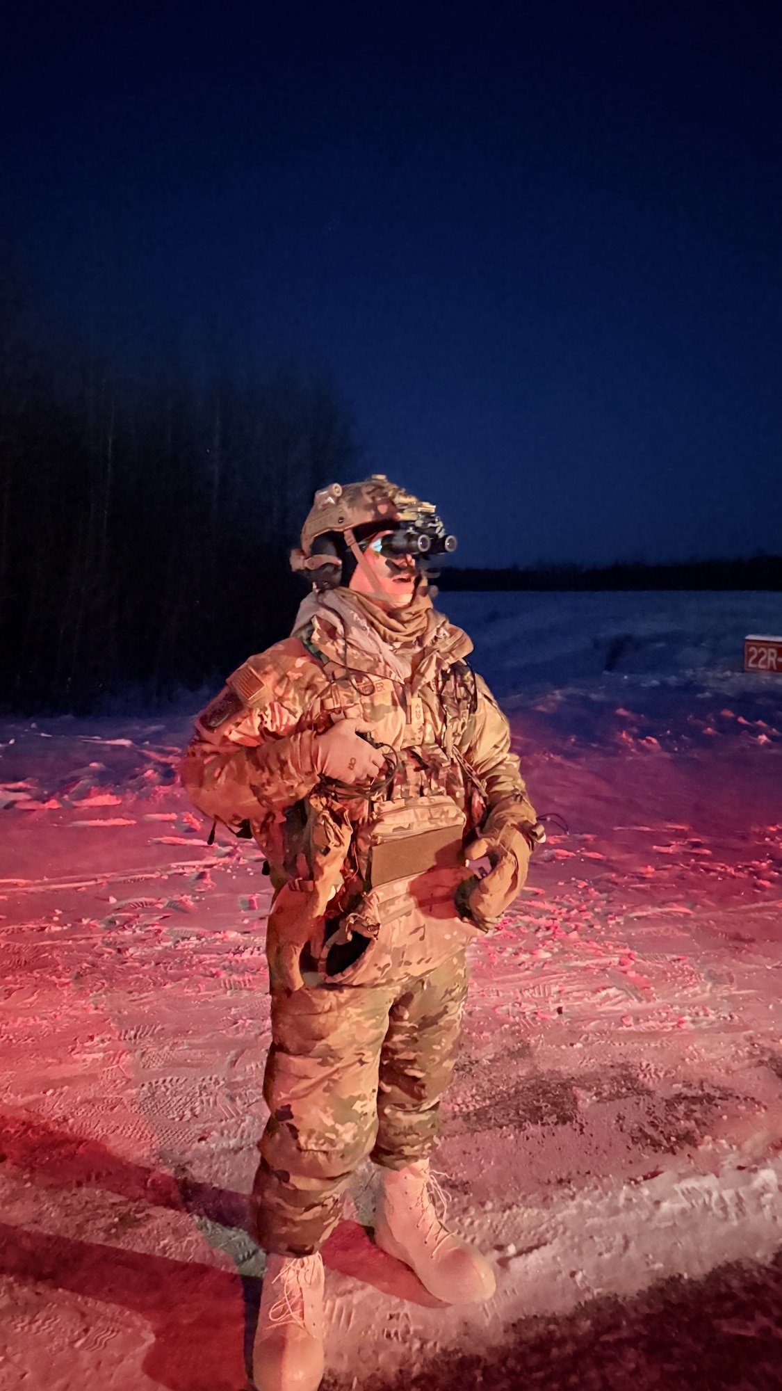 U.S. Air Force Senior Master Sgt. Brody Schneider, 354th Operations Support Squadron watch tower chief controller, operates night vision goggles during a landing zone operation training exercise at Eielson Air Force Base, Alaska Dec. 8, 2025.