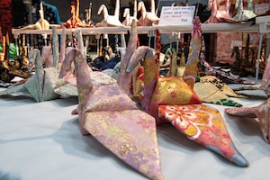 Cranes sit on table.