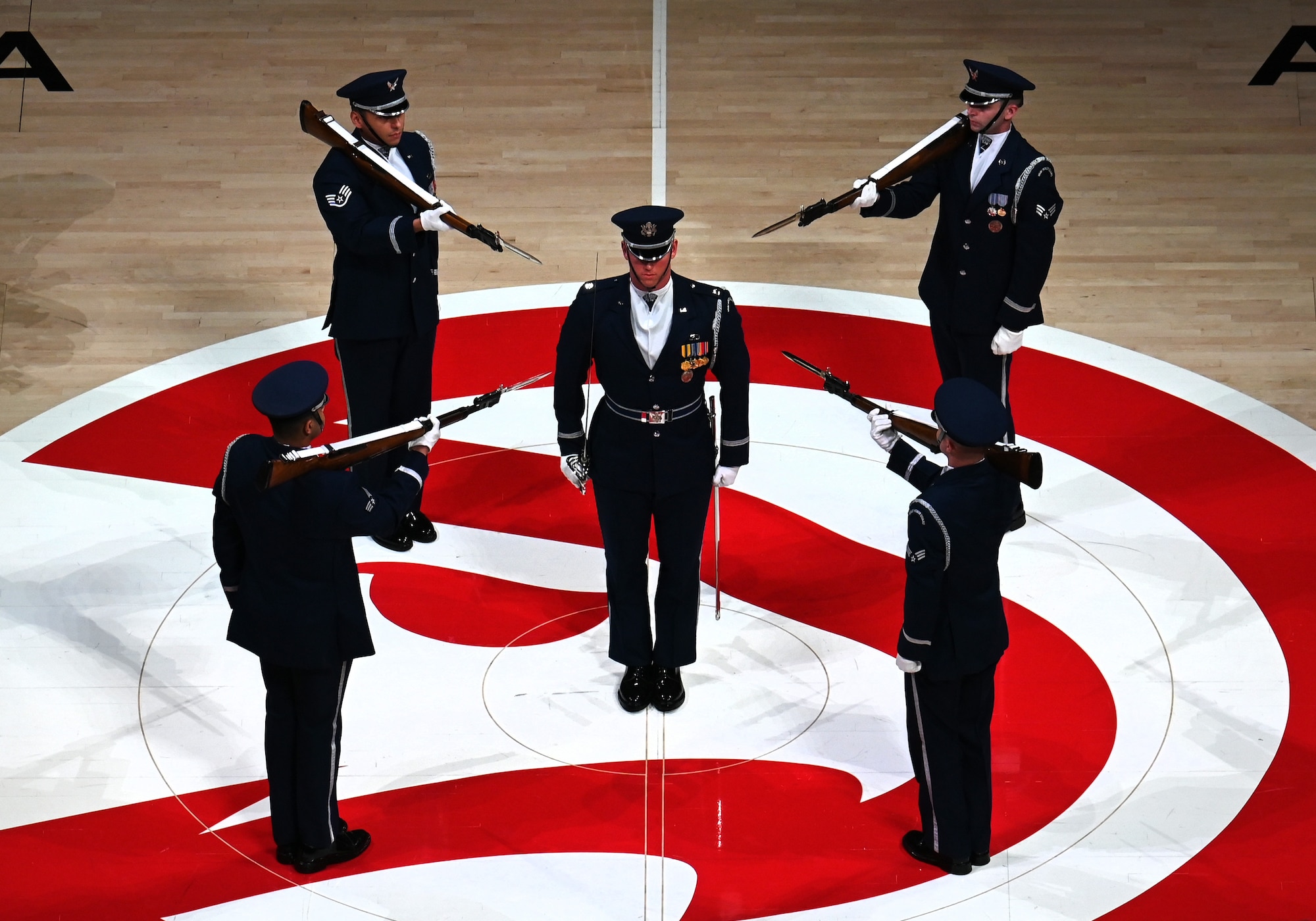 The U.S. Air Force Honor Guard Drill Team performs a weapons drill routine during an NBA halftime show in Atlanta, Ga., March 12, 2026. Originally created in 1948, the Drill Team performs more than 100 times a year at national sporting events, international military tattoos, community celebrations and school events, showcasing the Air Force’s readiness and excellence. (U.S. Air Force photo by Tech. Sgt. Sergio A. Gamboa)
