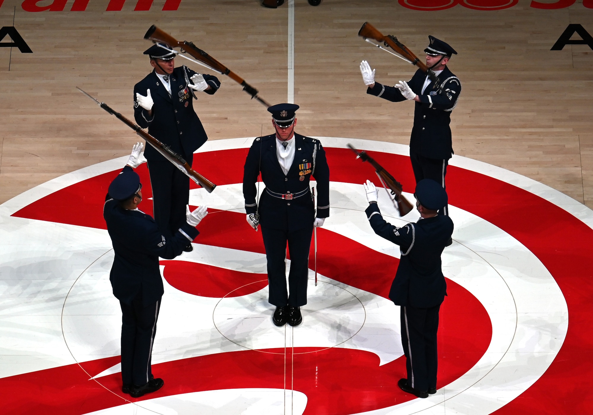 The U.S. Air Force Honor Guard Drill Team performs a weapons drill routine during an NBA halftime show in Atlanta, Ga., March 12, 2026. The Drill Team traveled to Georgia to perform for five high schools, a community event, and during a halftime show for the Atlanta Hawks vs. Brooklyn Nets basketball game to showcase the Air Force’s precision and excellence. (U.S. Air Force photo by Tech. Sgt. Sergio A. Gamboa)