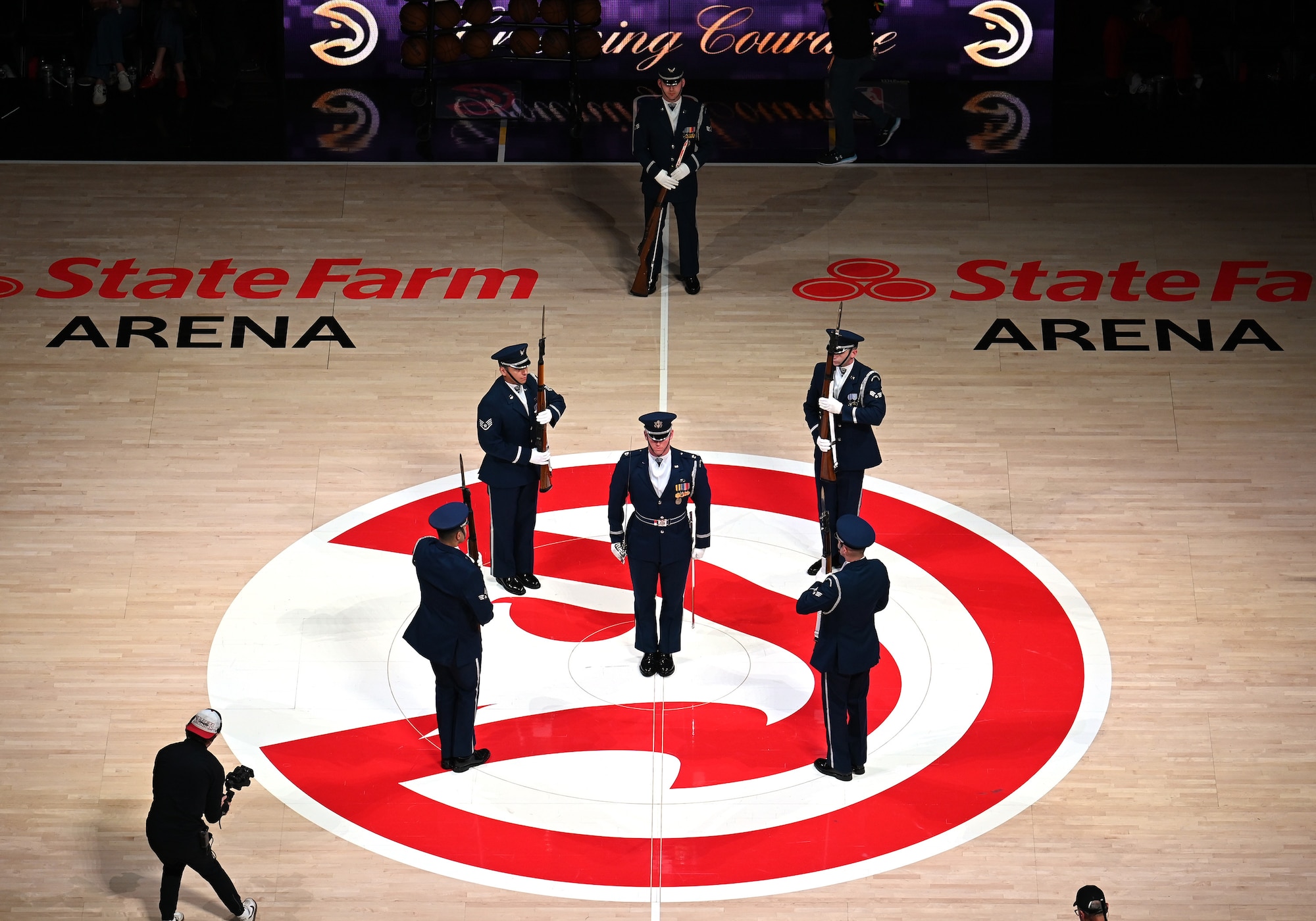 The U.S. Air Force Honor Guard Drill Team performs a weapons drill routine during an NBA halftime show in Atlanta, Ga., March 12, 2026. The Drill Team traveled to Georgia to perform for five high schools, a community event, and during a halftime show for the Atlanta Hawks vs. Brooklyn Nets basketball game to showcase the Air Force’s precision and excellence. (U.S. Air Force photo by Tech. Sgt. Sergio A. Gamboa)