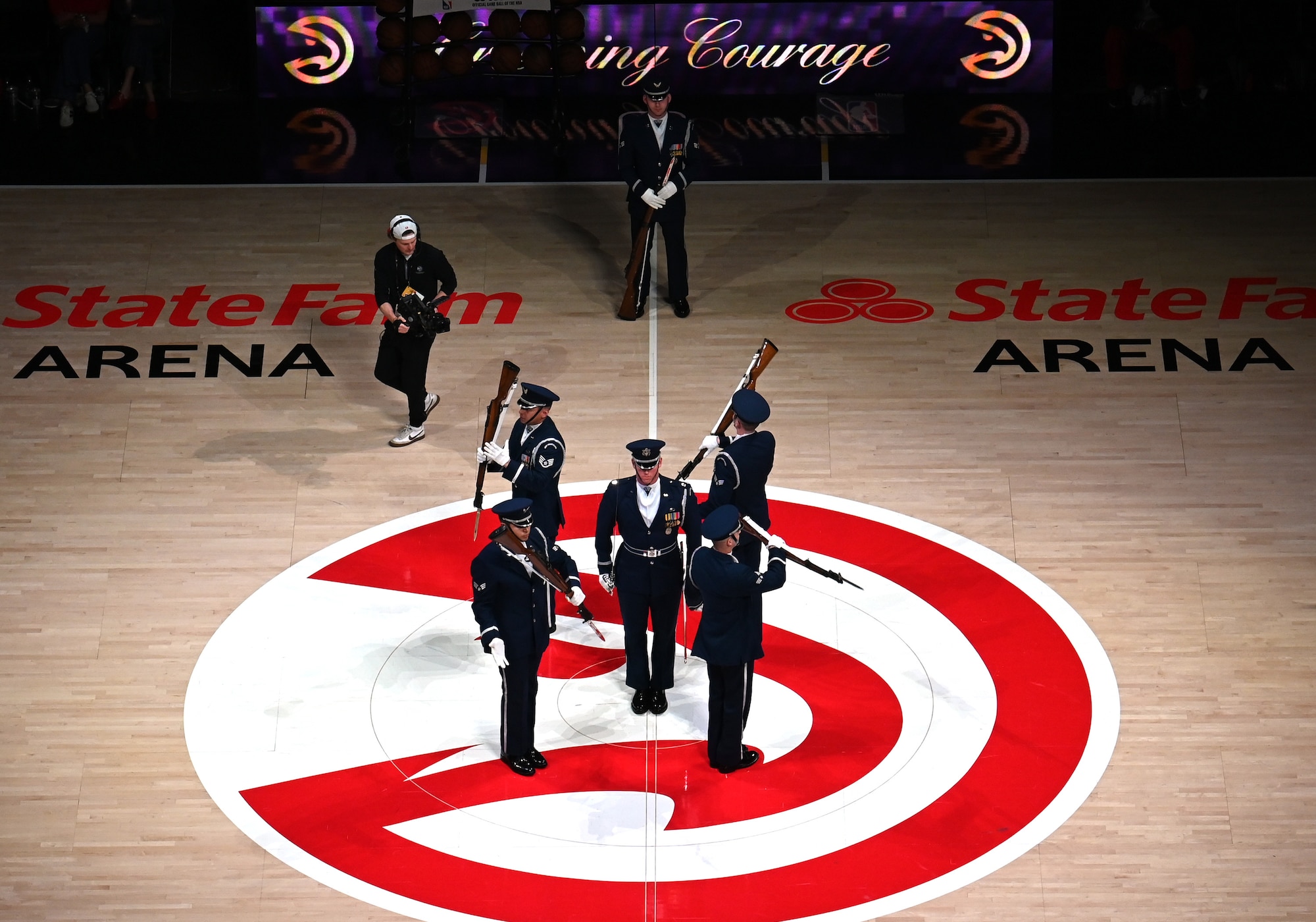 The U.S. Air Force Honor Guard Drill Team performs a weapons drill routine during an NBA halftime show in Atlanta, Ga., March 12, 2026. The Drill Team traveled to Georgia to perform for five high schools, a community event, and during a halftime show for the Atlanta Hawks vs. Brooklyn Nets basketball game to showcase the Air Force’s precision and excellence. (U.S. Air Force photo by Tech. Sgt. Sergio A. Gamboa)