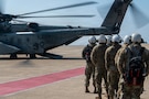 U.S. Air Force Airmen, assigned to the 8th Medical Group, prepare to board a U.S. Navy MH-53E Sea Dragon helicopter during a medical evacuation training as part of exercise Freedom Shield 26 at Kunsan Air Base, Republic of Korea, March 10, 2026. The exercise presents participants with realistic threat scenarios to strengthen shared understanding and combined defense capabilities. (U.S. Air Force photo by Staff Sgt. Cedrique Oldaker)
