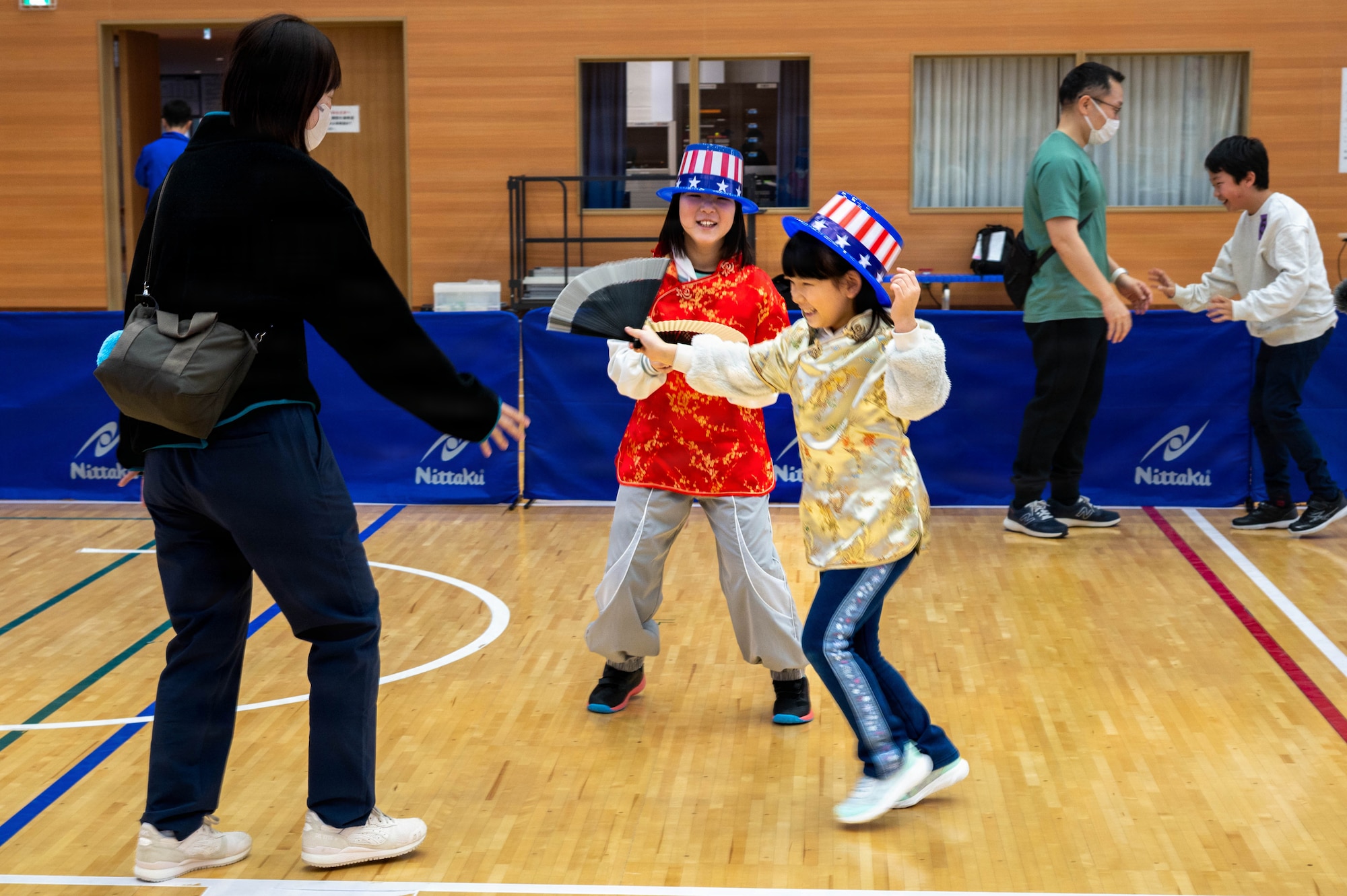 Kids dressed in costumes run and play during the 2026 Misawa City Sports Festival at the Misawa International Sports Center in Misawa City, Japan, Mar. 7, 2026.