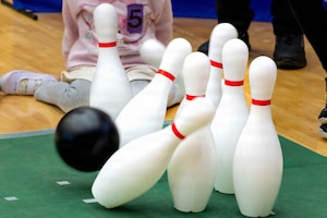 A bowling ball knocks over pins during the 2026 Misawa City Sports Festival at the Misawa International Sports Center in Misawa City, Japan, Mar. 7, 2026.