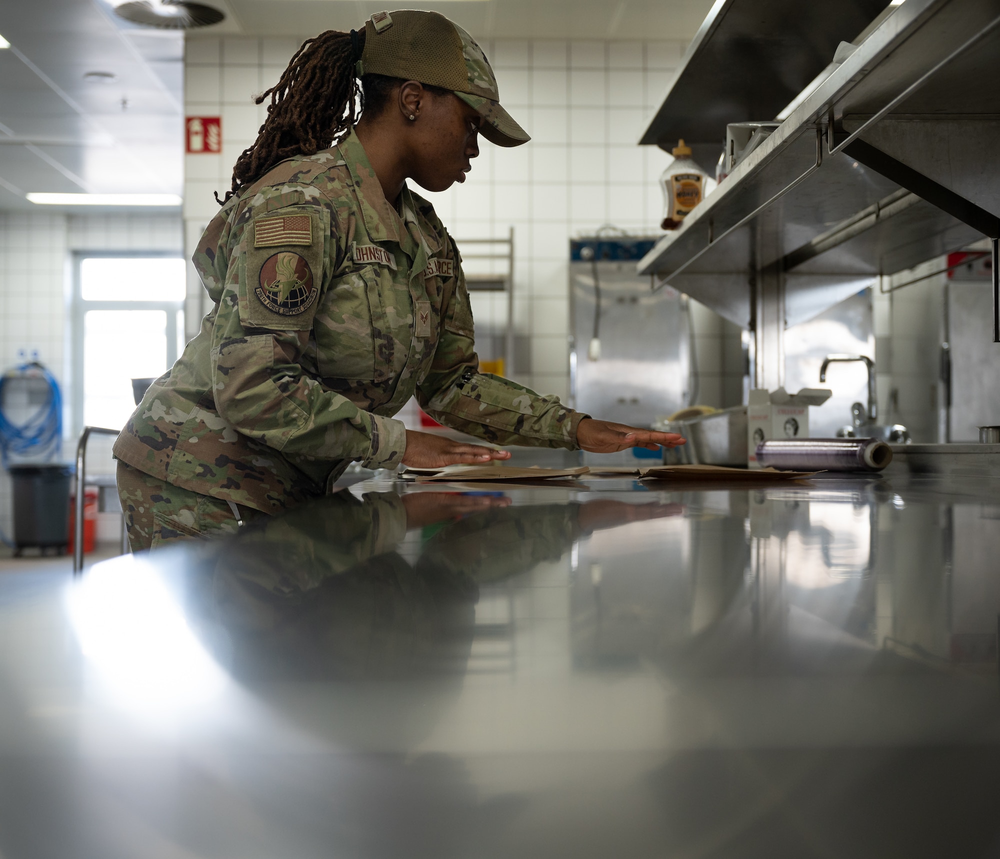 U.S. Air Force Senior Airman Kamiah Johnston, 786th Force Support Squadron food service journeyman, prepares meals in the Jawbone Flight Kitchen at Ramstein Air Base, Germany, March 10, 2026. The Jawbone Flight Kitchen is manned 24/7 by four Airmen who work in shifts to ensure that aircrews receive the food supplies they need to keep the mission going. (U.S. Air Force photo by Senior Airman Jared Lovett)
