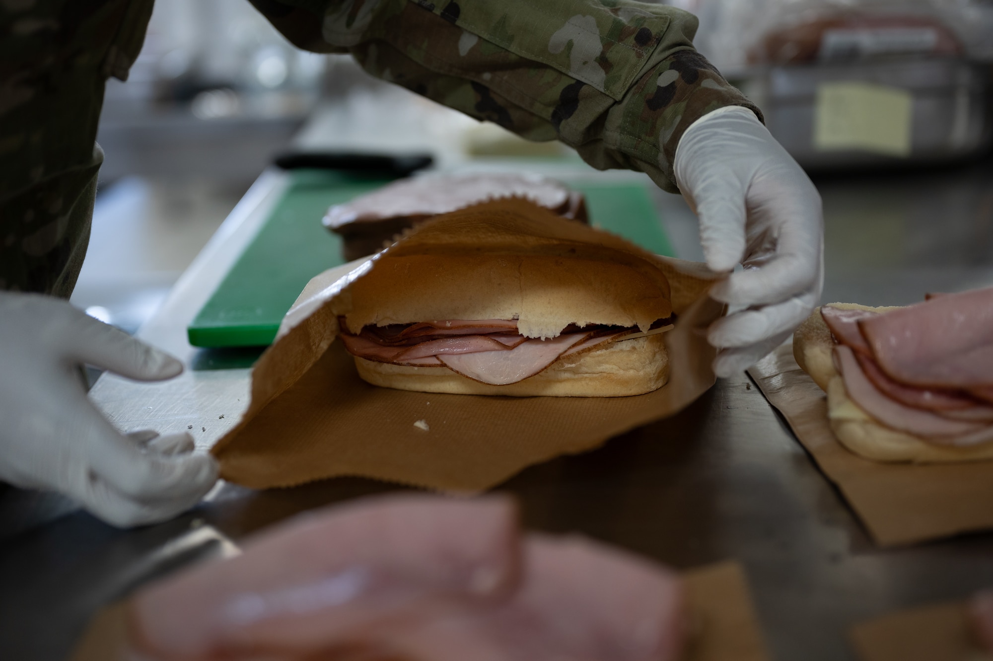 U.S. Air Force Senior Airman Kamiah Johnston, 786th Force Support Squadron food service journeyman, bags sandwiches in the Jawbone Flight Kitchen at Ramstein Air Base, Germany, March 10, 2026. With at least two hours’ notice the team can prepare the food and coordinate delivery to aircraft on the flightline. (U.S. Air Force photo by Senior Airman Jared Lovett)