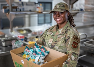 U.S. Air Force Senior Airman Kamiah Johnston, 786th Force Support Squadron food service journeyman, poses for a photo in the Jawbone Flight Kitchen at Ramstein Air Base, Germany, March 10, 2026. The Jawbone Flight Kitchen is manned 24/7 by four Airmen who work in shifts to ensure that aircrews receive the food supplies they need to keep the mission going. (U.S. Air Force photo by Senior Airman Jared Lovett)