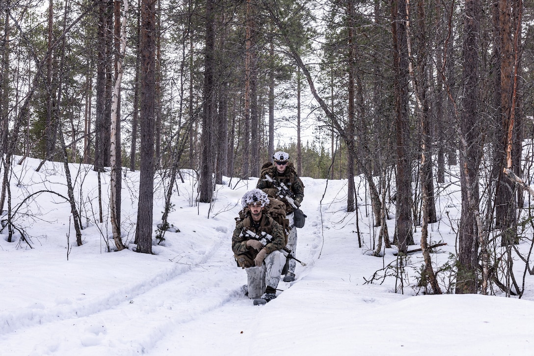 U.S. Marine Corps Cpl. Mario Velezpompa and Cpl. Michael Jeziorowski, both rifleman with 2nd Battalion, 6th Marine Regiment, 2nd Marine Division, pose for a photo during exercise Cold Response 26 in Setermoen, Norway, March 13, 2026. Service members from 2nd Marine Division and allied partners participated in a full-scale Force-on-Force with a combined simulation designed to test operational readiness, improve coordination, and synchronize integrated operations, enhancing mission efficiency in cold weather conditions. A key component of NATO's enhanced vigilance activity Arctic Sentry, exercise Cold Response 26 is a Norwegian-led winter military exercise designed to enhance collective defense capabilities and ensure U.S. readiness to rapidly deploy and seamlessly operate alongside NATO Allies in challenging arctic conditions. (U.S. Marine Corps photo by Cpl. Judith Ann Lazaro)