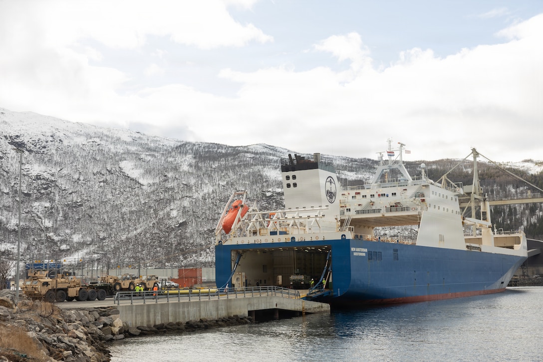 U.S. Marines with 2nd Distribution Support Battalion, Combat Logistics Regiment 27, 2nd Marine Logistics Group, load the roll-on/roll-off cargo ship New Amsterdam with tactical vehicles in Narvik, Norway, March 15, 2026. Marines loaded ground and logistical equipment assigned to Marine Corps Prepositioning Program-Norway onto a ferry for future regeneration of the caves during exercise Cold Response 26. A key component of NATO's enhanced vigilance activity Arctic Sentry, exercise Cold Response 26 is a Norwegian-led winter military exercise designed to enhance collective defense capabilities and ensure U.S. readiness to rapidly deploy and seamlessly operate alongside NATO Allies in challenging arctic conditions. (U.S. Marine Corps photo by Lance Cpl. Franco Lewis)