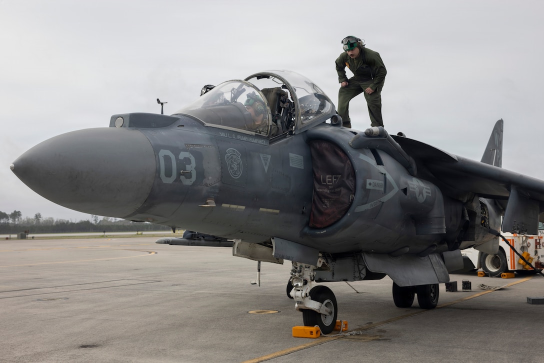 U.S. Marine Corps Sgt. Sean Wray, from Pennsylvania, left, and Cpl. Marco Bustamante, from Texas, both avionics technicians with Marine Attack Squadron (VMA) 223, Marine Aircraft Group 14, 2nd Marine Aircraft Wing, conduct maintenance on an AV-8B Harrier II at Marine Corp Air Station Cherry Point, North Carolina, March 12, 2026. VMA-223 is the AV-8B Harrier II squadron assigned to 2nd MAW. 2nd MAW generates, deploys and sustains expeditionary, combat- ready units to provide flexible and responsive aviation support to combatant commander presence, security cooperation, and crisis-response missions. (U.S. Marine Corps photo by Lance Cpl. Perri Wood)