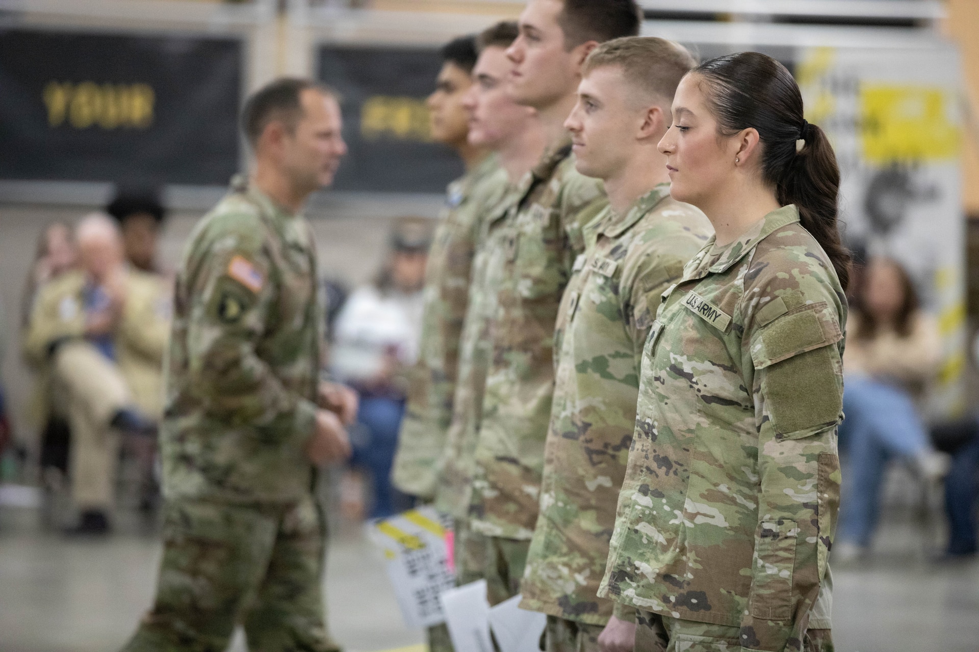 U.S. Army Command Sgt. Maj. Jesse Withers, Kentucky's state command sergeant major, congratulates participants in the Kentucky Enlistment Enhancement Program (KEEP) during a ceremony at Boone National Guard Center in Frankfort, Nov. 19, 2025. KEEP is an initiative that pays Soldiers for enlistments that they refer to the Guard. (U.S. Army National Guard photo by Milt Spalding)