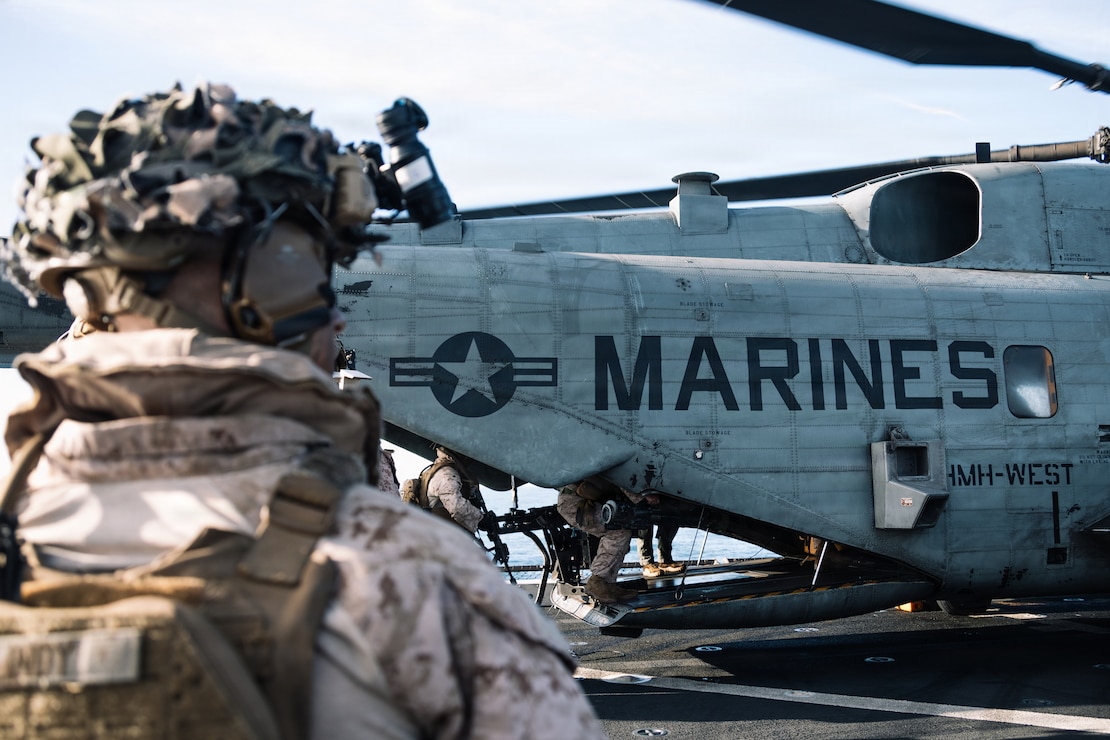 U.S. Marines with Lima Company, Battalion Landing Team 3/5, 11th Marine Expeditionary Unit, board a CH-53E Super Stallion with Marine Medium Tiltrotor Squadron (VMM) 163 (Reinforced), 11th MEU, before an amphibious assault in the Pacific Ocean, March 2, 2026.