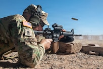 U.S. Army National Guard 1st Sgt. Benjamin Mason, assigned to the Arizona Training Center, Arizona National Guard, fires his M4 rifle during the annual Adjutant General Match at Florence Military Reservation, Ariz., March 13, 2026.