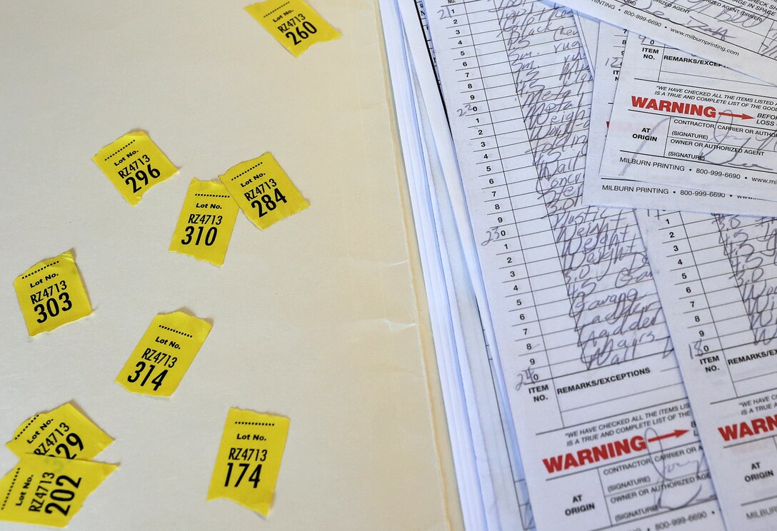 PCS inventory sheets alongside lot number labels.