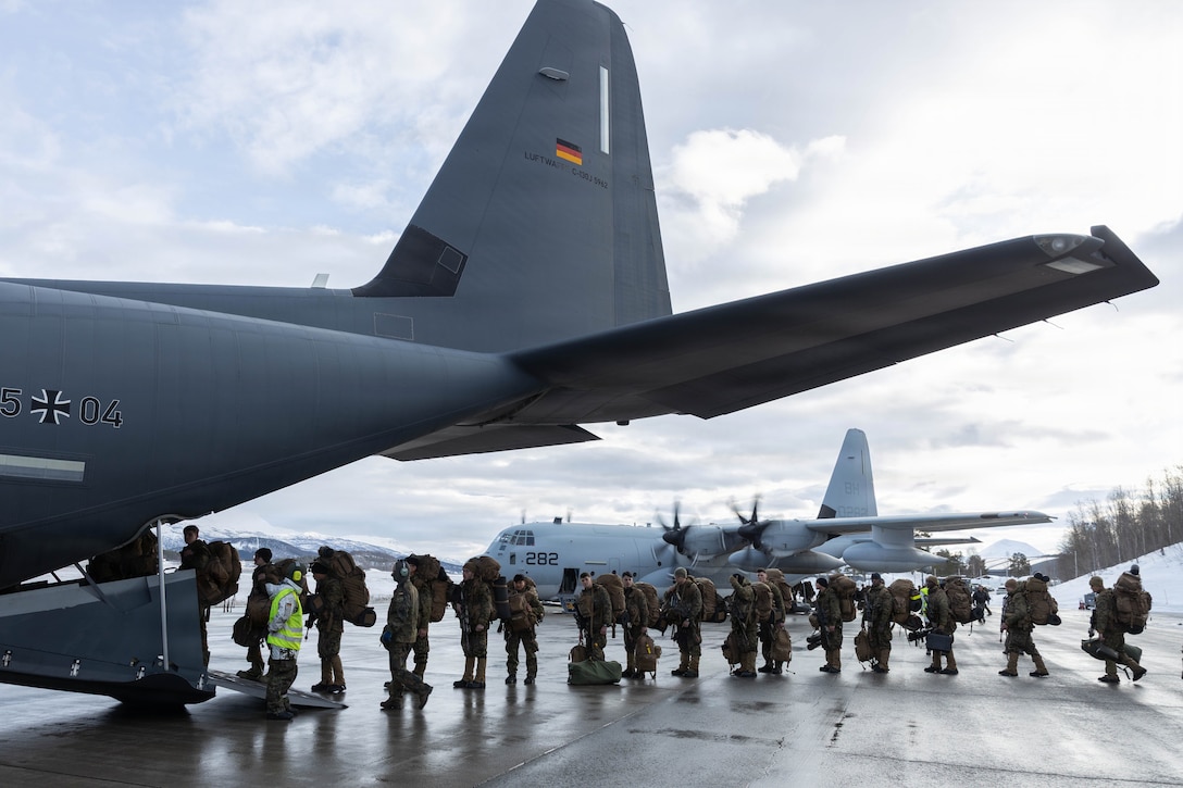 U.S. Marines with 2nd Battalion, 6th Marine Regiment, 2nd Marine Division, board a C-130 aircraft with the German-French Binational Air Transport Squadron (BATS) at Bardufoss Airport, Norway, March 11, 2026.