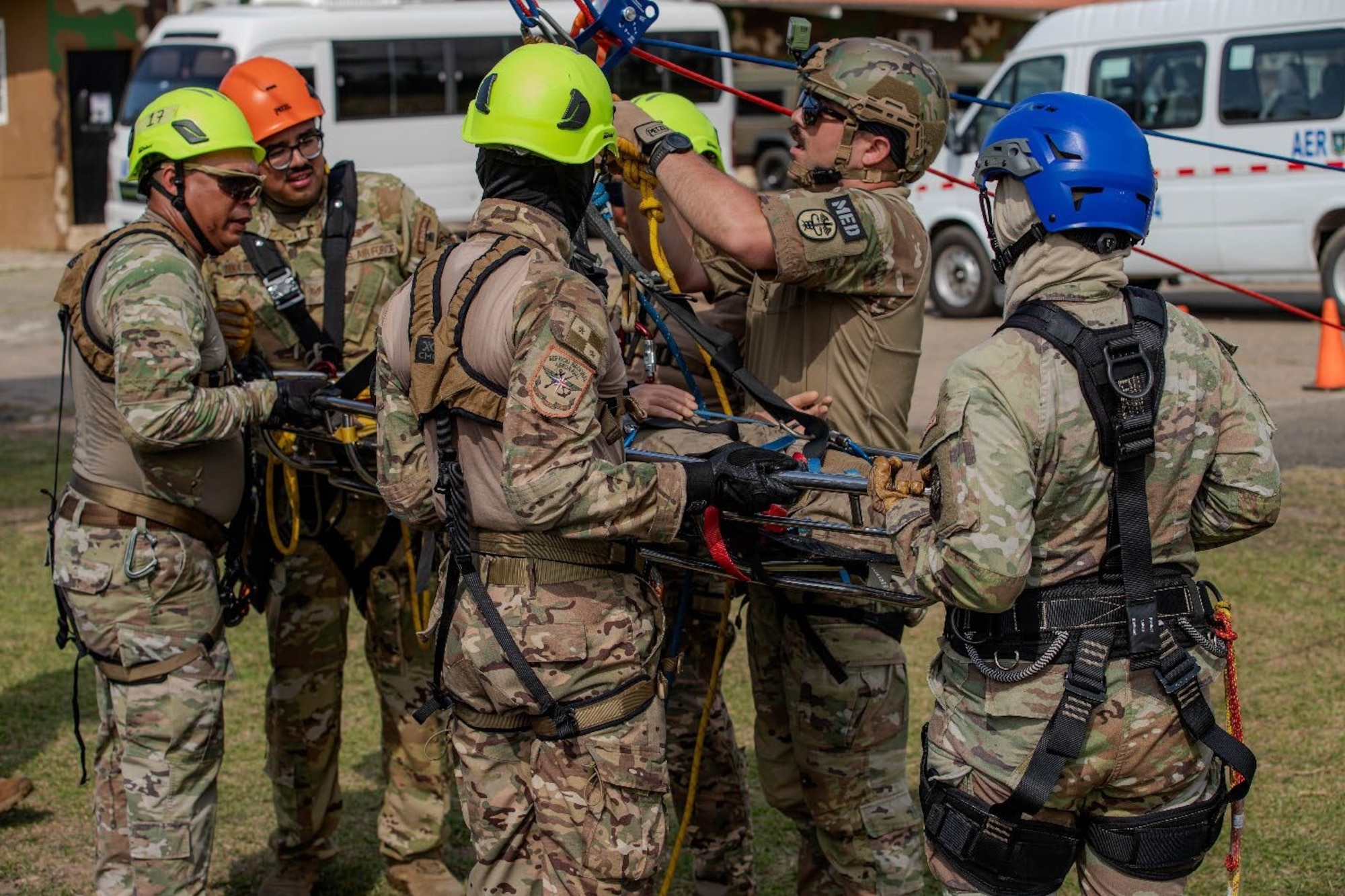 Men attach repelling equipment.