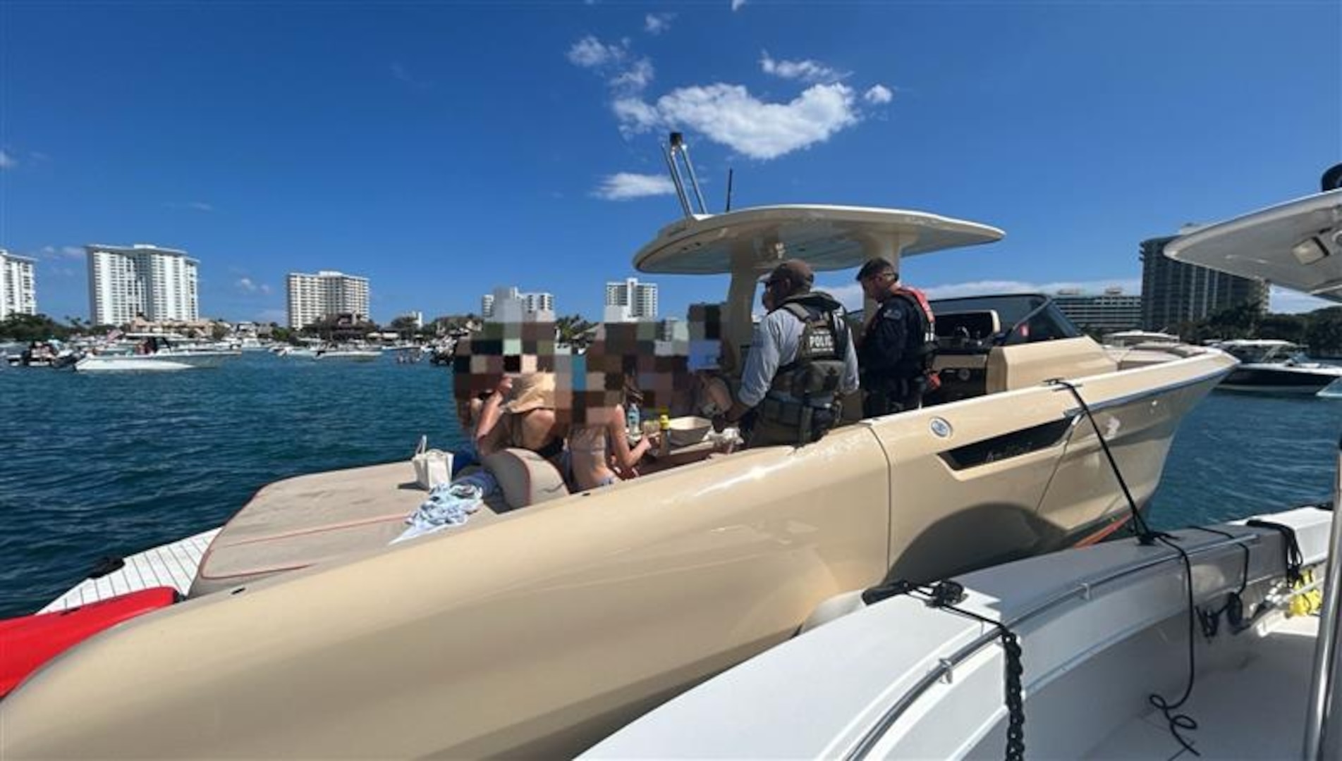 Coast Guard Sector Miami law enforcement officers, along with federal and state law enforcement partners, conduct a boarding of a 37-foot recreational vessel, Piacere, in the vicinity of Lake Boca, Florida, March 14, 2026. During the boarding, it was determined that the vessel was being operated as an illegal small passenger vessel with 12 passengers for hire. (U.S. Coast Guard photo)