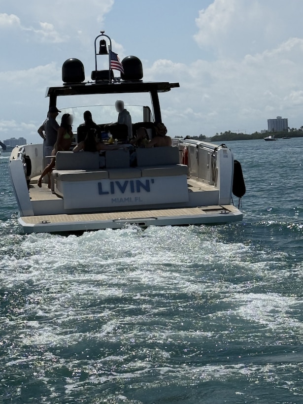 Coast Guard Sector Miami law enforcement officers, along with federal and state law enforcement partners, conduct a boarding of a 39-foot recreational vessel, LIVIN, in the vicinity of Indian Creek, Florida, March 14, 2026. During the boarding, it was determined that the vessel was being operated as an illegal small passenger vessel with 5 passengers for hire. (U.S. Coast Guard photo)