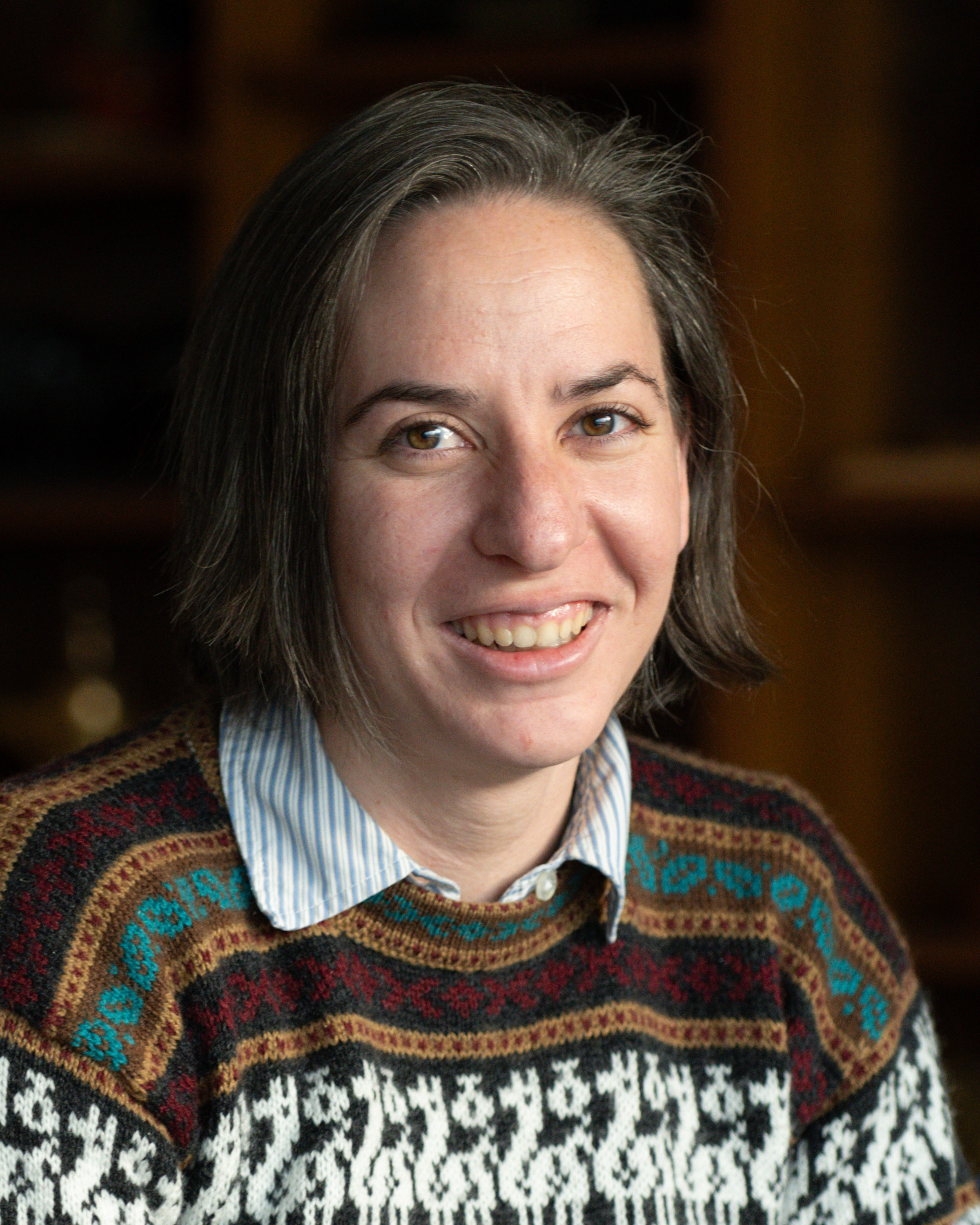 Headshot of Bethany Hess, Plans and Operations Officer, against a neutral background.