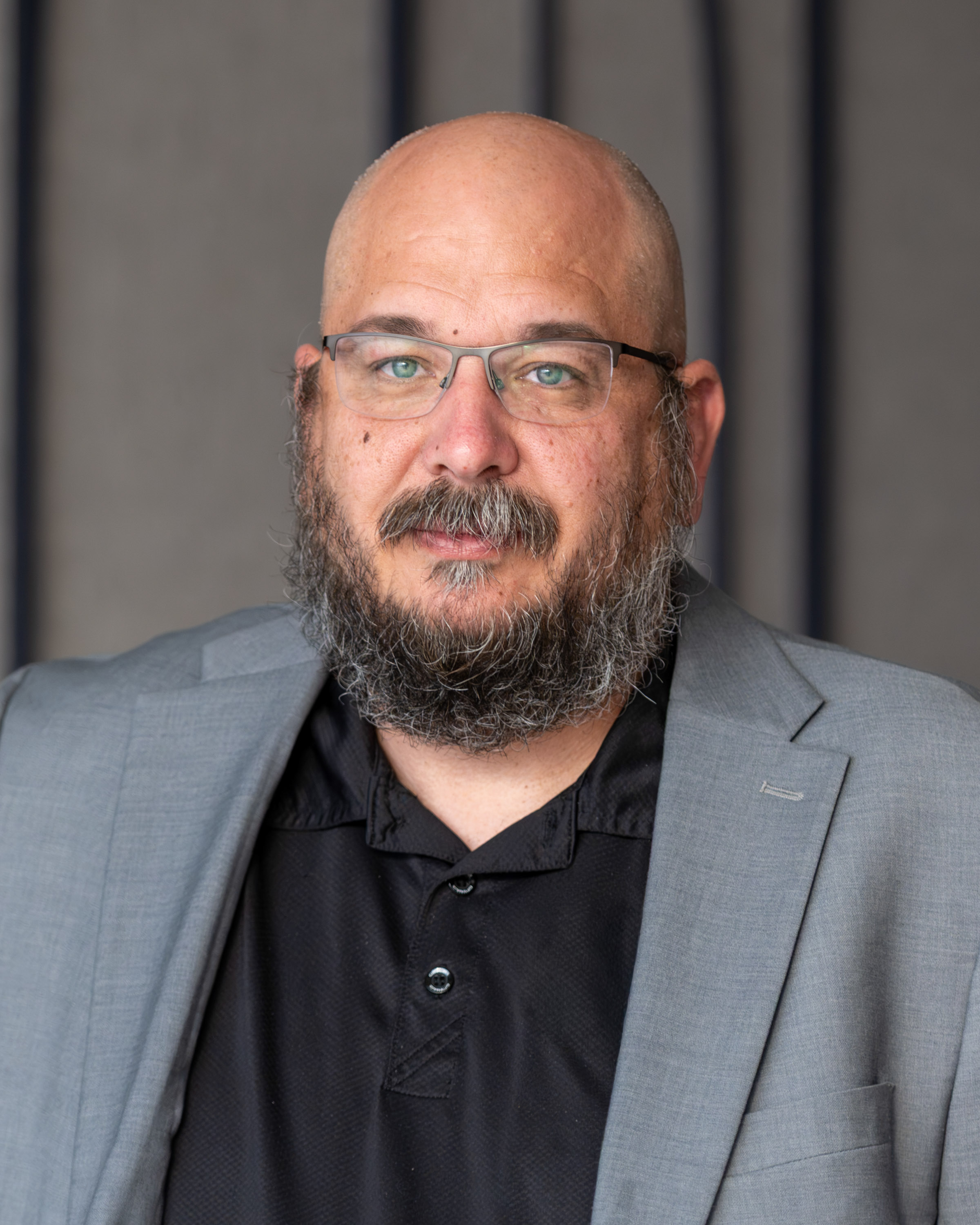 Headshot of Christopher Biggs, Plans and Operations Assistant, against a neutral background.