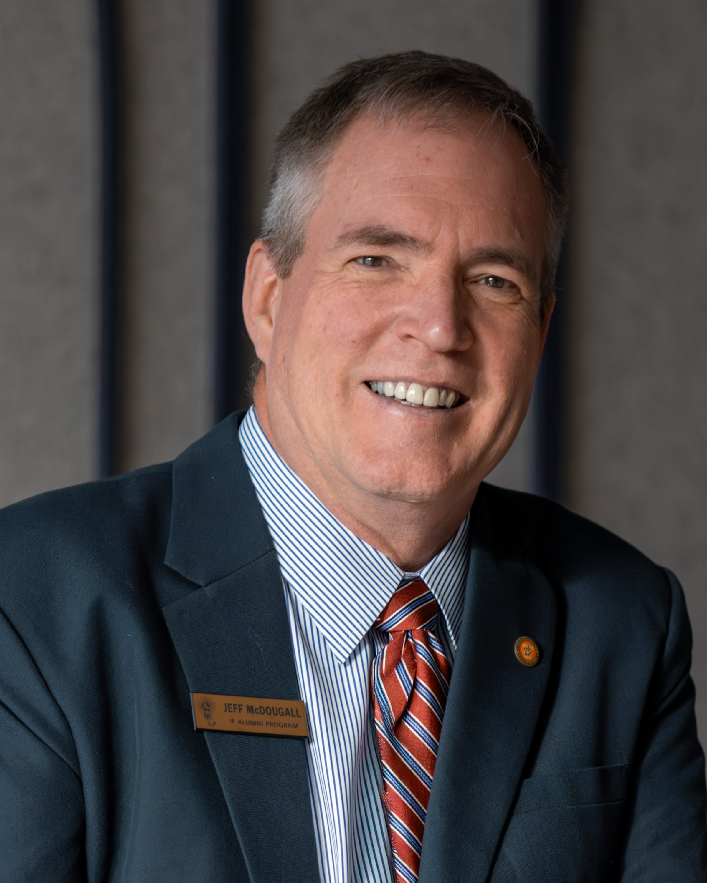 Headshot of Jeff McDougall, International Fellow staff, against a neutral background.