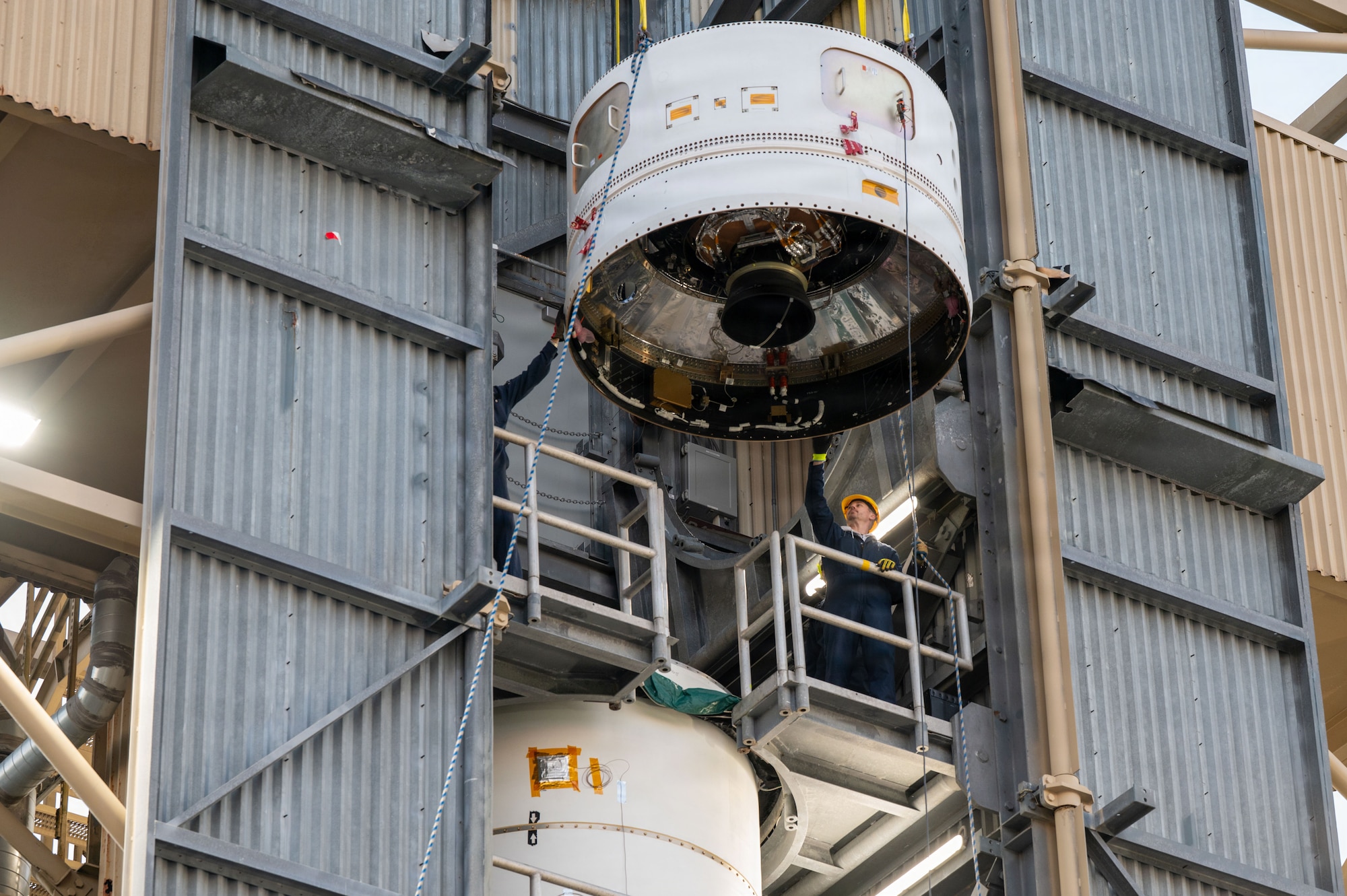 a rocket motor is lifted by a crane