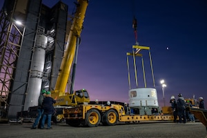 a rocket motor is lifted by a crane