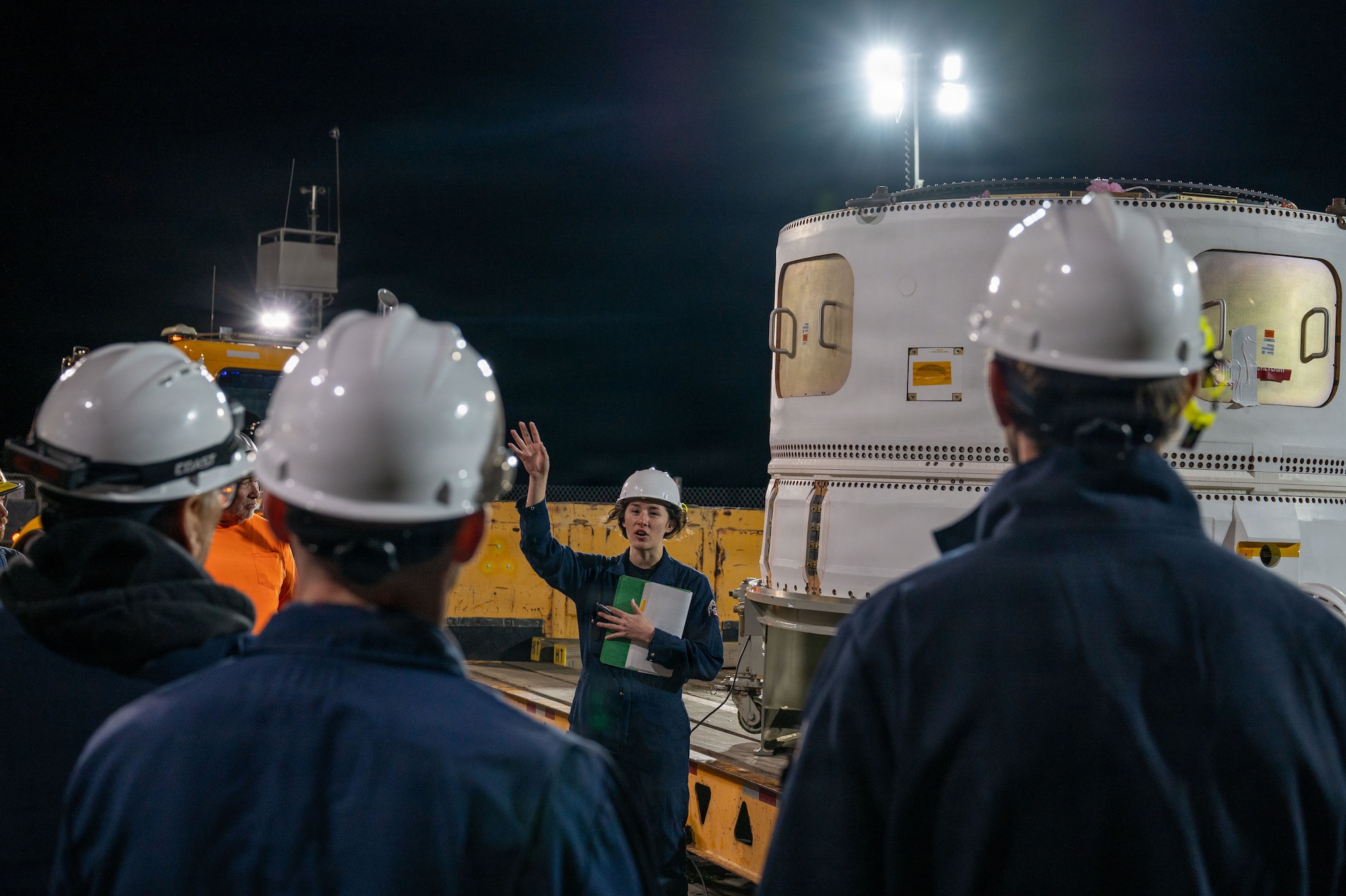 a person speaks to a group of people