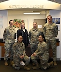 Members of the Outpatient Nutrition Clinic team pose for a group photo at David Grant Medical Center, Travis Air Force Base, Calif., Dec 10, 2025. The clinic provides body composition testing, group education, and individualized nutrition counseling to support military readiness and patient-centered care.