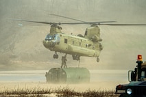 U.S. Army Soldiers assigned to 3rd Battalion, 2nd Aviation Regiment, 2nd Combat Aviation Brigade, 2d Infantry Division/ROK–U.S. Combined Division, conduct sling load operations in support of the 11th Engineer Battalion during Freedom Shield at an undisclosed location, March 14, 2026.