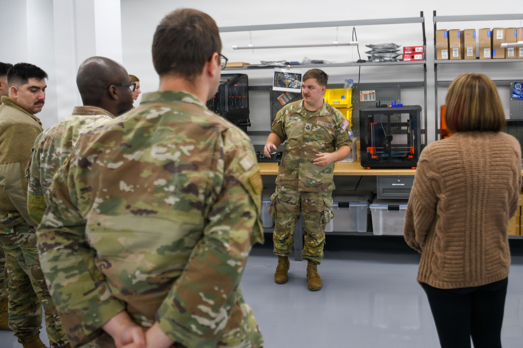 U.S. Space Force Sgt. Nicolas M. Breiding, Delta 2 Signals Intelligence Analysis noncommissioned officer in charge, speaks to a group of people.