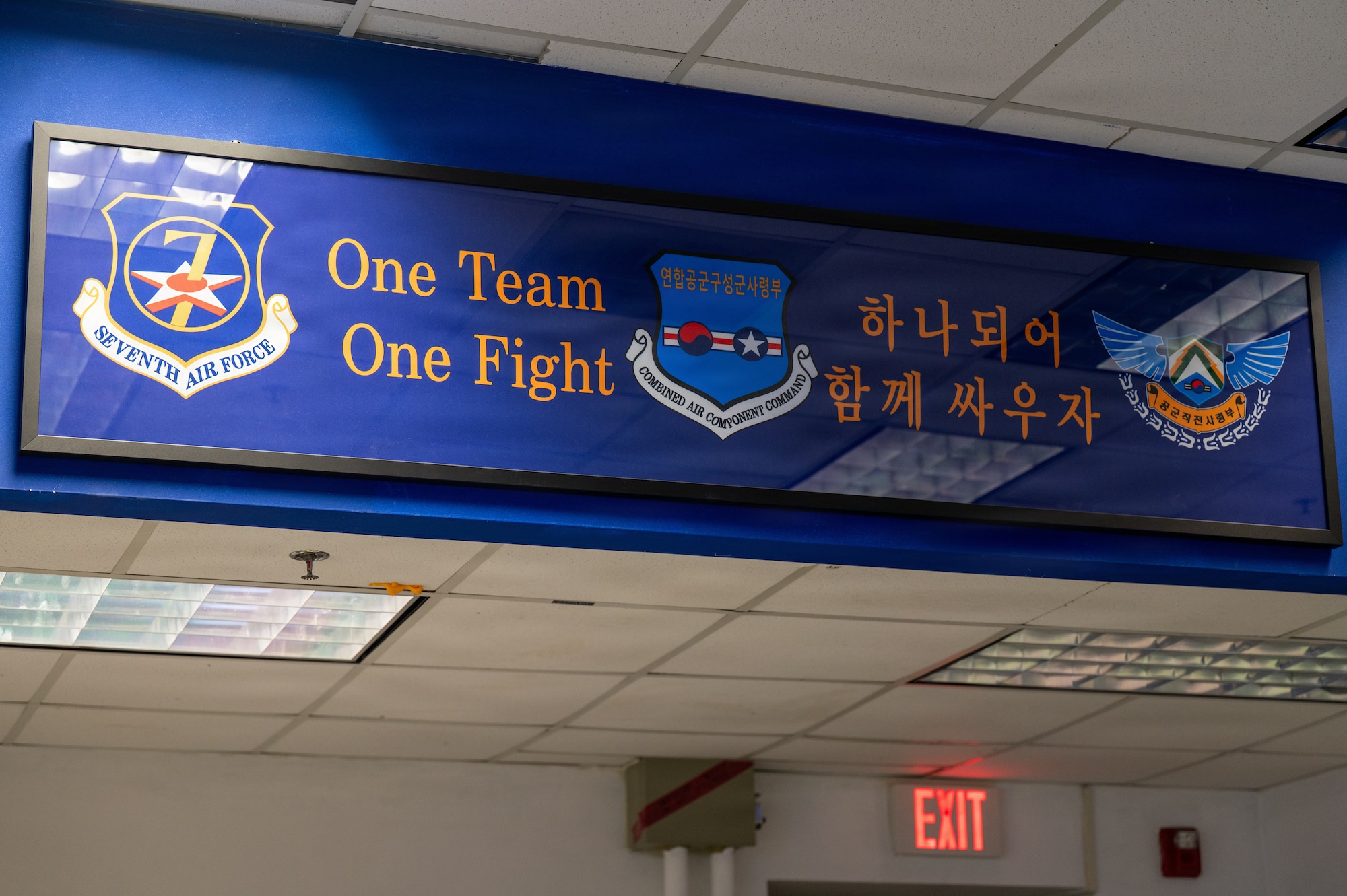 A sign displays the Seventh Air Force, Combined Air Component Command and Republic of Korea Air Operations Command shields during exercise Freedom Shield 26 at Osan Air Base, Republic of Korea, March 12, 2026.