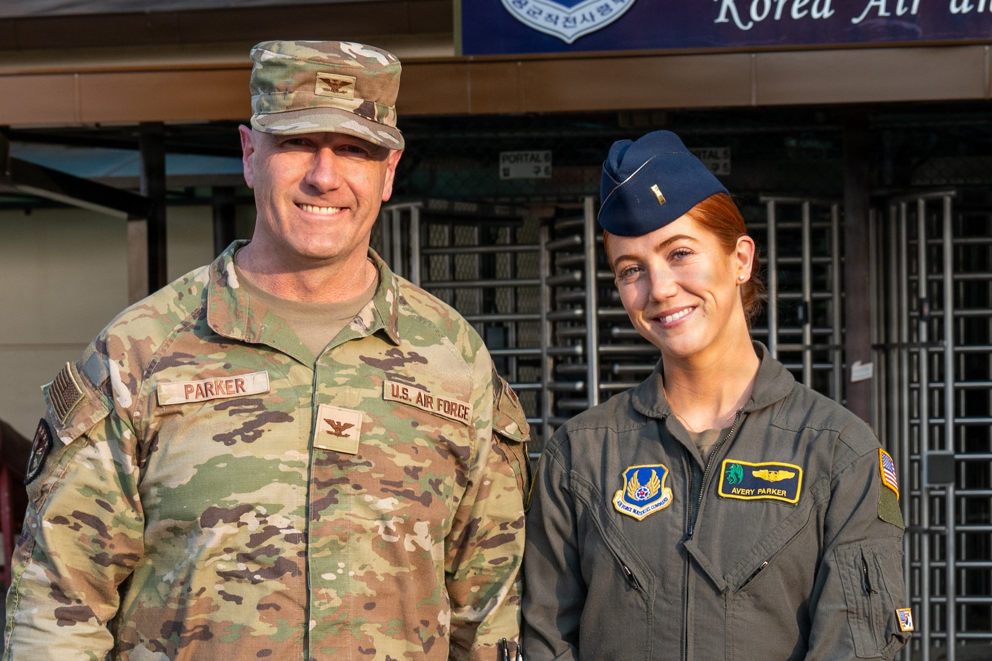 U.S. Air Force Col. William Parker, United States Forces Korea J1 assistant chief of staff, and 2nd Lt. Avery Parker, 607 Air Operations Center combat operations division flight test engineer augmentee, pose for a photo at Osan Air Base, Republic of Korea, March 17, 2026.