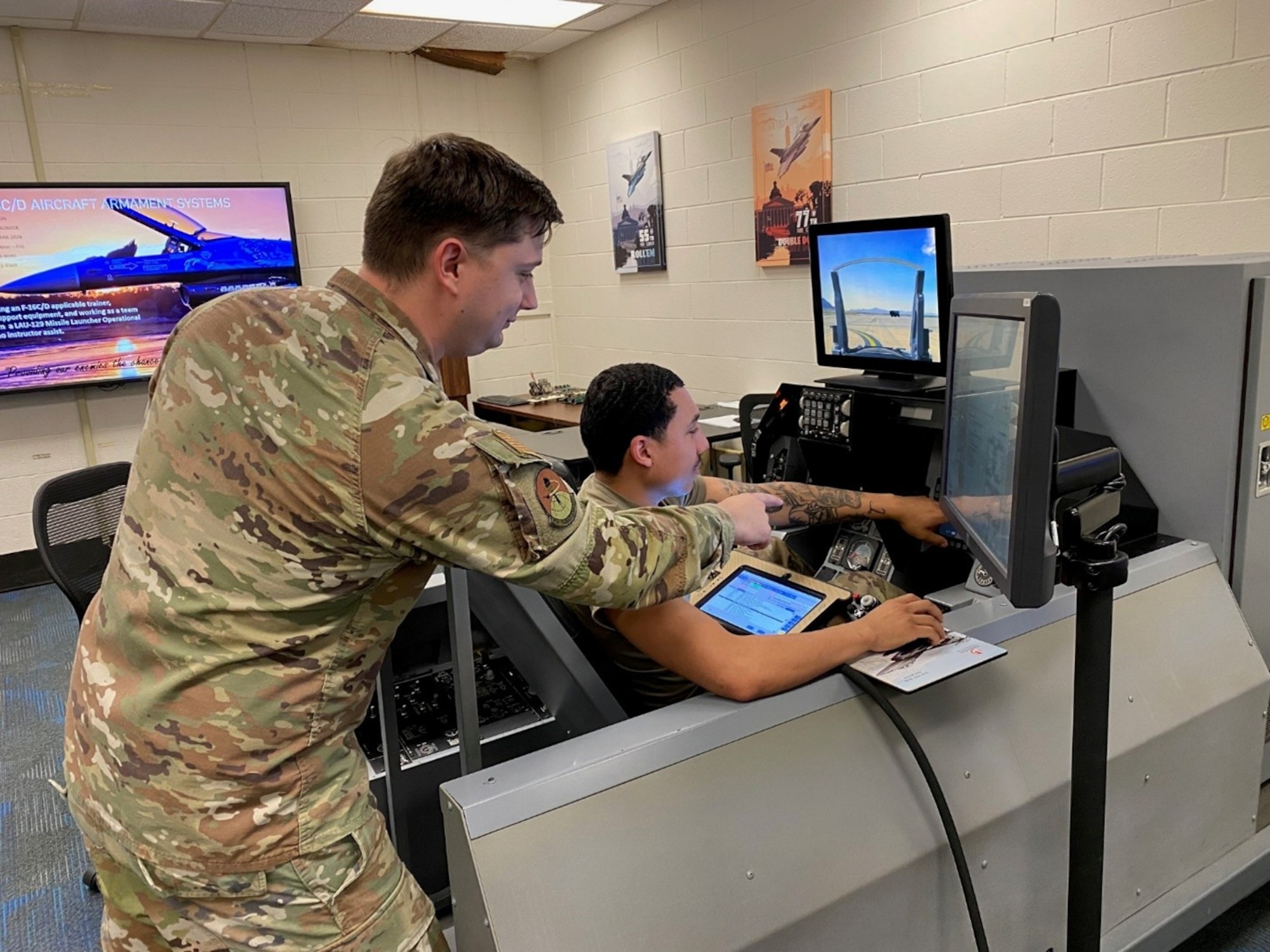 .S. Air Force Technical Sgt. Joshua Akin, 372nd Training Squadron / Detachment 202 FTD Instructor, teaches Wing Weapons Pylon operational checkout procedures.