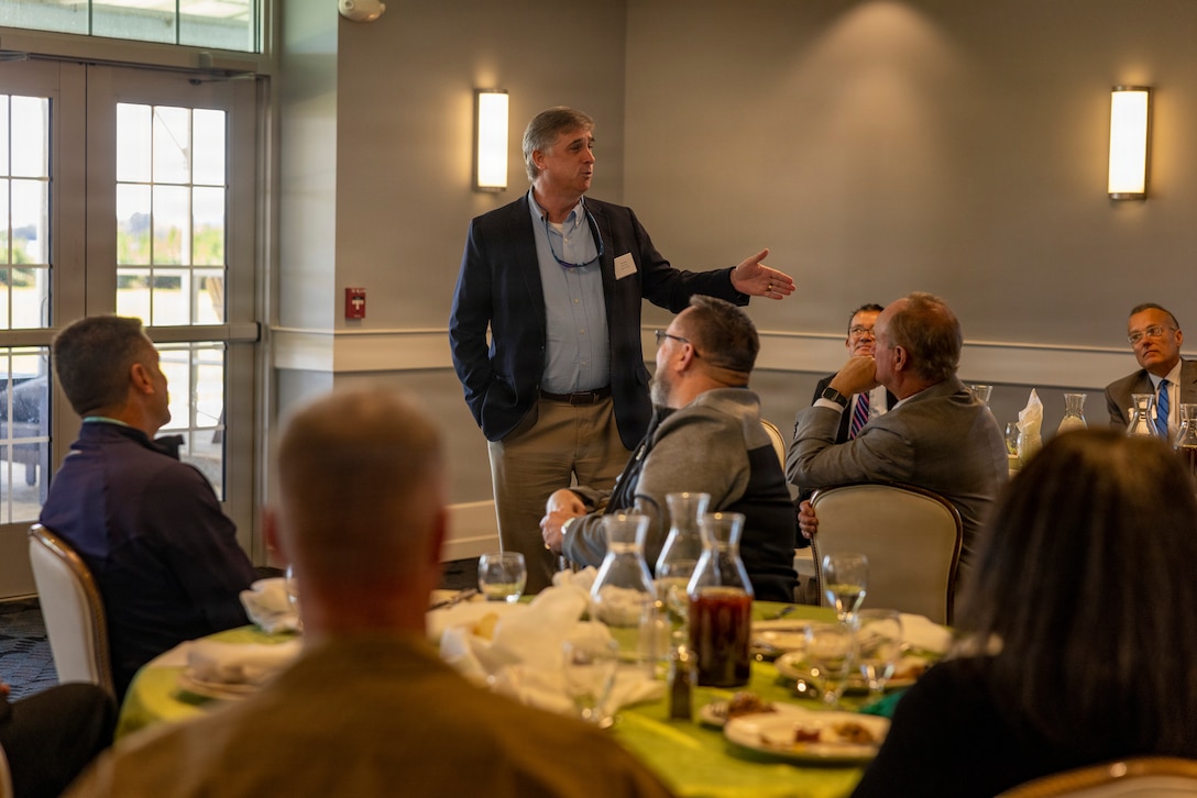 Tim Foster, chairman of the Onslow County Board of Commissioners, speaks with elected officials and Marine Corps leaders during a community partnership meeting at The Landing on Marine Corps Air Station New River, Jacksonville, North Carolina, March 17, 2026. The meeting brought together military and local government leaders to discuss regional growth, infrastructure, and shared efforts to support the installation, surrounding communities and quality of life for service members and their families. (U.S. Marine Corps photo by Cpl. Jessica J. Mazzamuto)