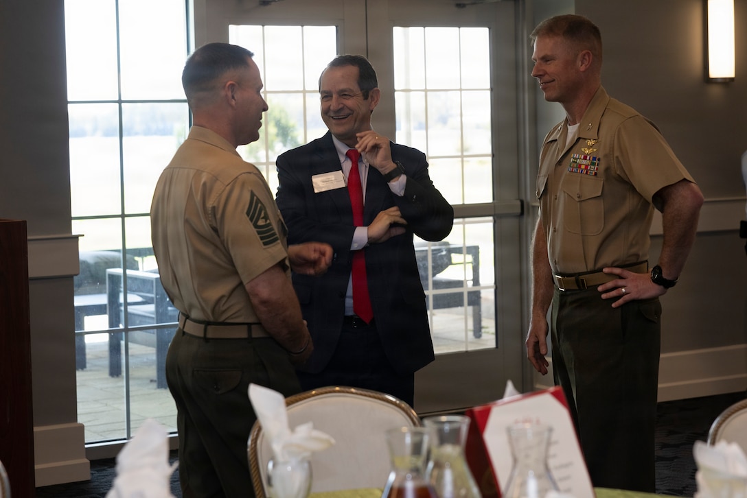U.S. Marine Corps Col. Thomas C. Farrington II, right, commanding officer, Marine Corps Air Station New River, and Sgt. Maj. Jared B. Game, left, senior enlisted leader, MCAS New River, speak to Senator Mike Lazzara, North Carolina Senator, during a community partnership meeting at The Landing on Marine Corps Air Station New River, Jacksonville, North Carolina, March 17, 2026.  The meeting brought together military and local government leaders to discuss regional growth, infrastructure, and shared efforts to support the installation, surrounding communities and quality of life for service members and their families. (U.S. Marine Corps photo by Cpl. Jessica J. Mazzamuto)