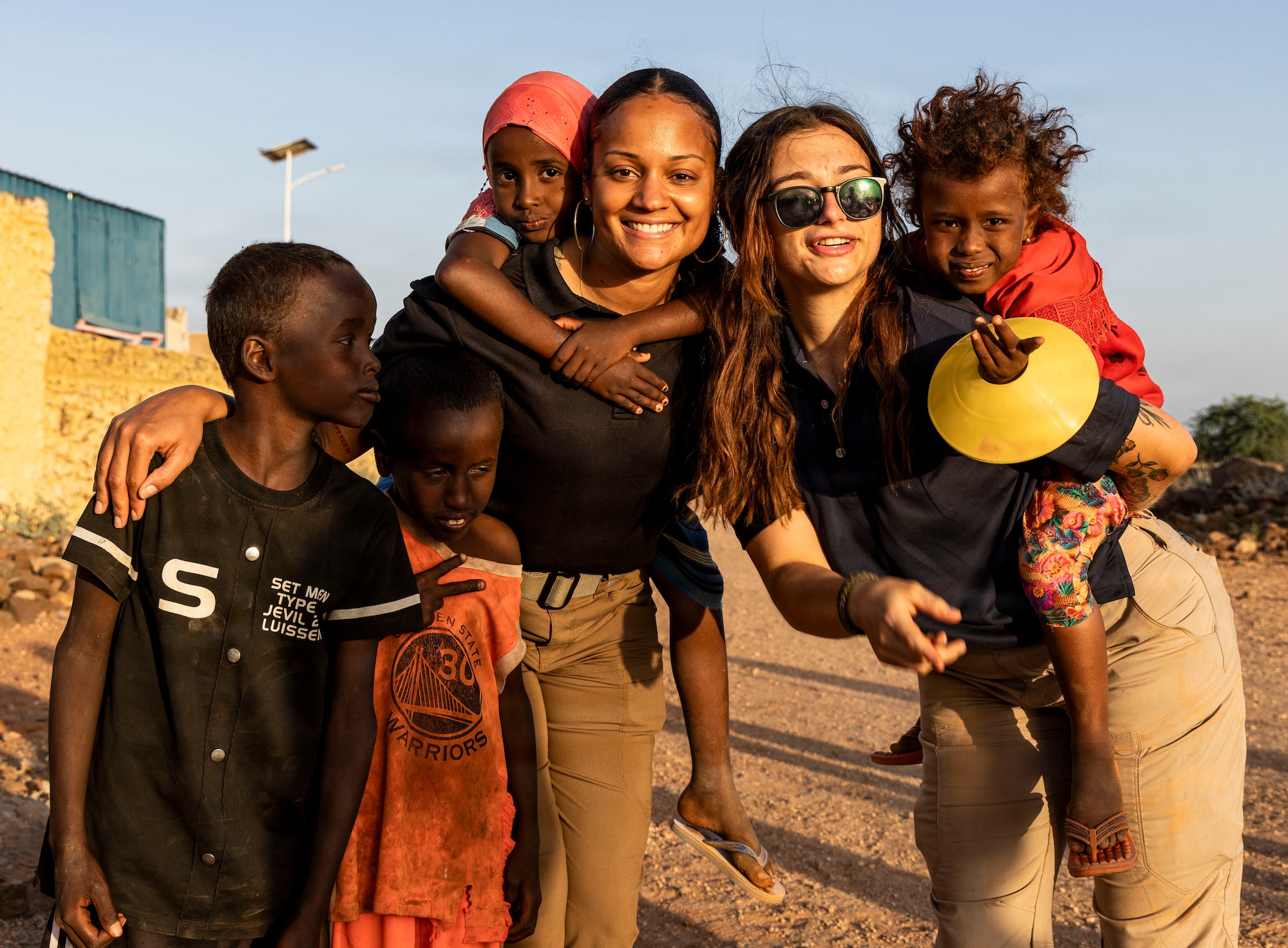 U.S. service members interact with children