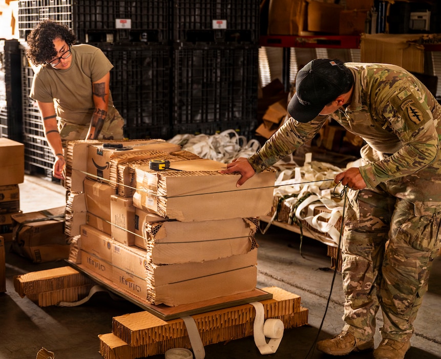 U.S. Soldiers assigned to Joint Special Operations Task Force – Somalia, prepare donated supplies for palletization
