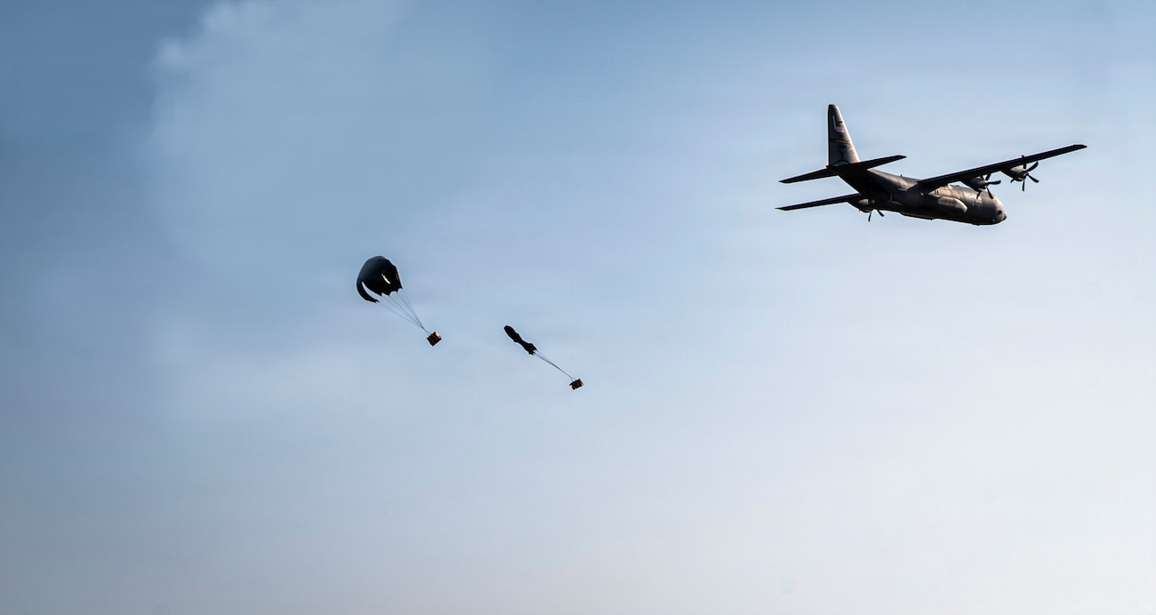 A U.S. Air Force C-130J Super Hercules cargo aircraft drops two bundles of humanitarian supplies during a humanitarian mission known as the “Chabelley Care Drop” at Chabelley Airfield, Djibouti, Feb. 21, 2026.